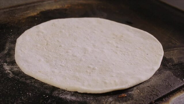 making an Italian tortilla on the stove