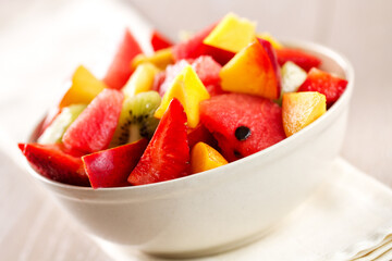 Fresh fruit salad with strawberries, blueberries watermelon and peaches