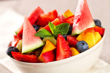 Fresh fruit salad with strawberries, blueberries watermelon and peaches