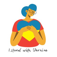 I stand with Ukraine. The girl hugs a heart with the colors of the flag of Ukraine. Support for Ukraine. No war. Ukraine in the heart.