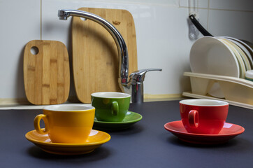 Beautiful color cups on a dark background