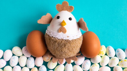 Chicken doll with eggs on a blue background.