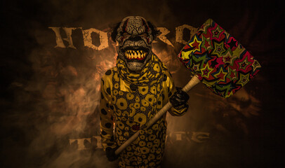 scary clown with a sledgehammer