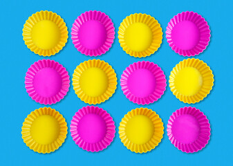 Abstract shapes background with group of yellow and pink rounded objects on blue background