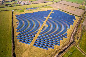High aerial view of solar farm in UK sunshine