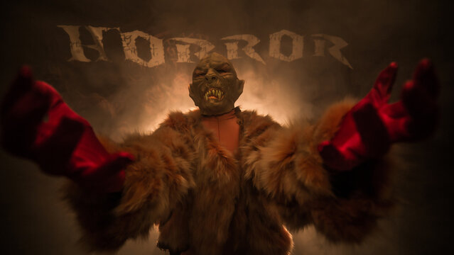 a vampire dressed in fur stands in the smoke and wants your blood