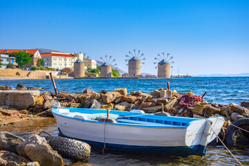 Fototapeta na wymiar Old windmills by the beach, Chios island, Greece.