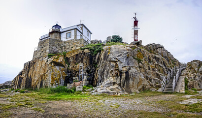 Panoramic view of the lighthouse on the Galician coast on a cloudy day
