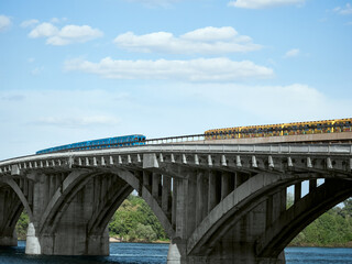 Two metro trains on the bridge over the Dnieper river. Kiev, Ukraine.