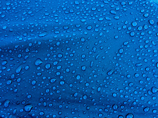 Water drops on waterproof membrane fabric. Morning dew on tent.