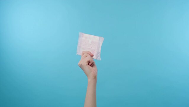 Woman hand showing sanitary pad