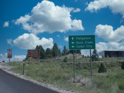 Roadside sign with directions to Bryce Canyon National Park, Panguitch, Duck Creek and Cedar City in Utah.