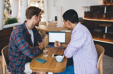 Multiracial business men working in office space