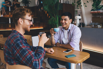 Multiracial business men working in office space