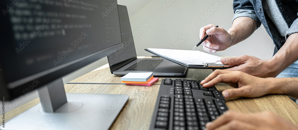 Aufkleber writing codes and typing data code technology, programmer team working on web site project in a soft