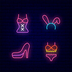 Women clothing for sex play neon icons set. Rabbit ears, high heels, corset and underwear. Vector stock illustration