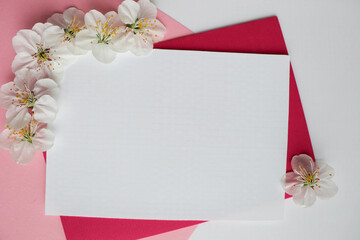 postcard mockup. Frame from flowering spring branches and white blank for the text. congratulation. invitation