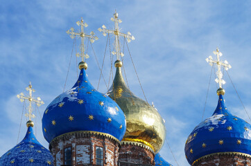 Domes of the Orthodox Church against the blue sky.