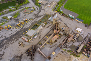 Heavy mining machinery in a quarry for the extraction of stone, industrial panorama
