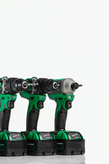 Drill. Set of cordless drills on a white background. Tool for drilling and making holes. Screwdriver set with high capacity spare batteries.