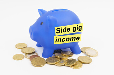On the table are coins and a blue piggy bank with the inscription - Side gig income