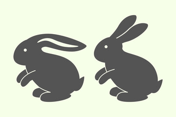 Naklejka premium two animal hare silhouettes. Easter Bunny. silhouette on a white background.