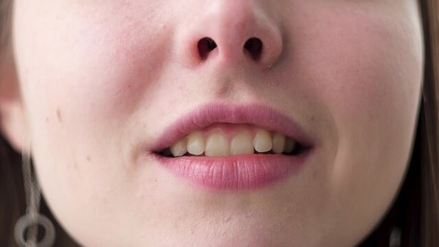 Close up view of speaking female mouth