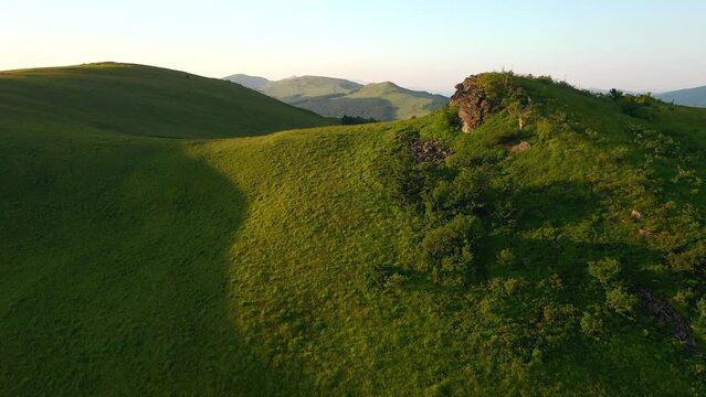 Splendid green hills from a bird's eye view. Filmed in UHD 4k video.