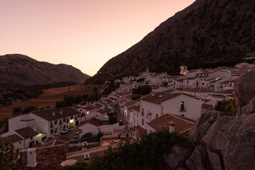Panoramic view of the beautiful andalusian white town of Villaluenga del Rosario in Grazalema mountain range at sunset, Cadiz, Andalusia, Spain