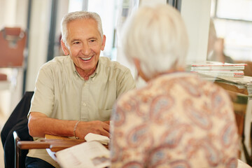 They never miss their coffee date. Shot of a smiling senior couple taking together in a cafe.