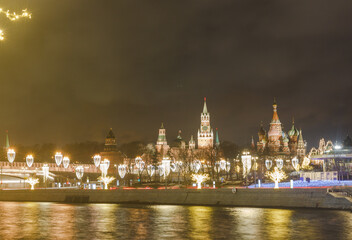 Moscow, Russia. Night view of The Moscow Kremlin from opposite bank of Moscow Rver, Zaryadye park, St. Basil's cathedral.
