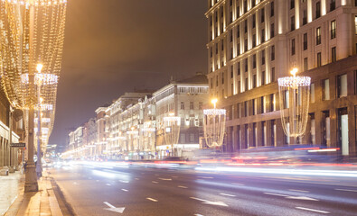 Obraz premium Moscow, Russia, Feb 22, 2022: Night view of Tverskaya street near Triumphalnaya square. Direction to Tverskaya zastava square. Car traces