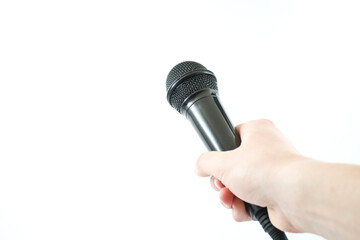 hand holding a microphone on white background