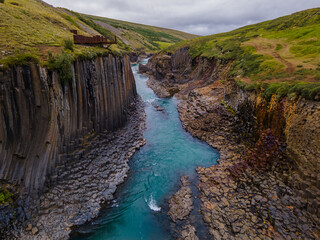Beautiful aerial view of the studlagil canyon, and the largest number of basalt rock columns in Iceland