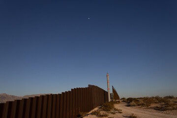Sunset on the wall that divides the border between Mexico and the United States in Ciudad Juárez Chihuahua and El Paso Texas,