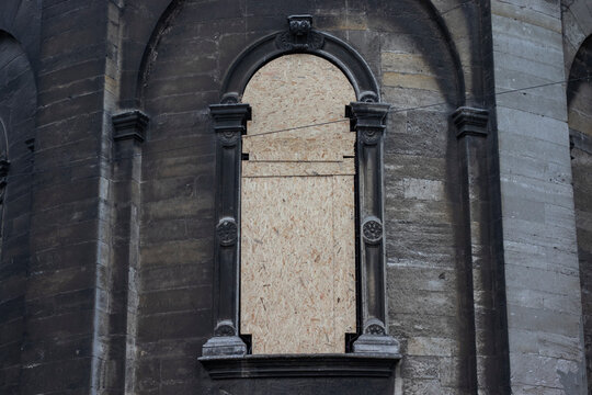 Lviv, Ukraine - March 8, 2022. The war in Ukraine. The stained glass windows of the Dormition (Wallachian) Church are covered with wooden shields for safety.