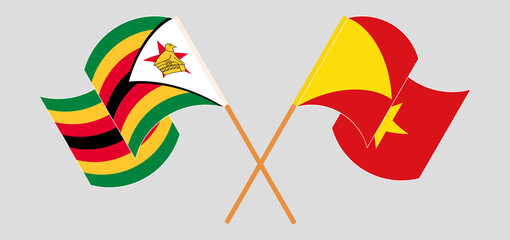 Crossed and waving flags of Zimbabwe and Tigray