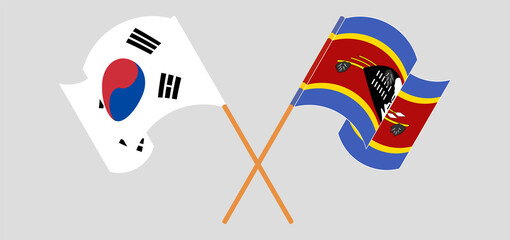 Crossed and waving flags of South Korea and Eswatini