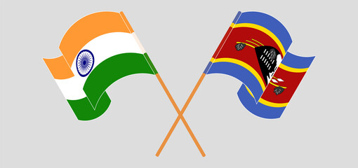 Crossed and waving flags of India and Eswatini