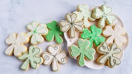 an assortment of clover sugar cookies on a platter