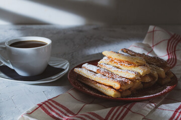 Fresh pastries and a white cup of coffee