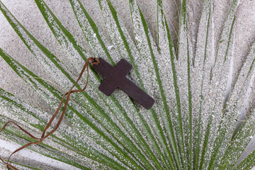 Ash Wednesday and Lent concept. Christian Cross on the palm leaf. Concept for Lent Season, Holy...