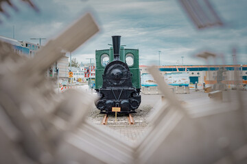 Old small steam locomotive on a display at the port in Reykjavik, as a memory of once part of only train line in Iceland