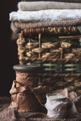Close Up of Spools of Silk Ribbon against an Antique Woven Sewing Basket