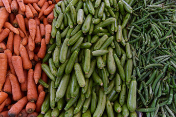 Carrots, zucchini, peas on the counter of the Egyptian market. Fresh vegetables in the street bazaar