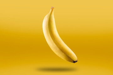 Ripe bananas isolated on yellow background.