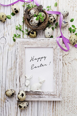 easter greeting card with quail eggs and spring flowers. mock up frame with copy space