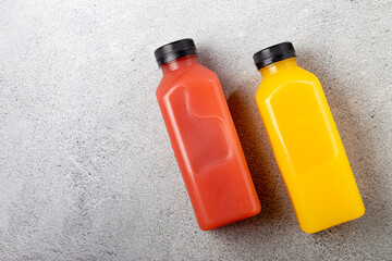 Healthy fruit smoothies in plastic bottles.