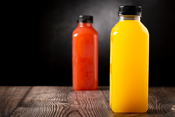 Healthy fruit smoothies in plastic bottles.