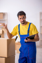 Young male contractor doing home relocation